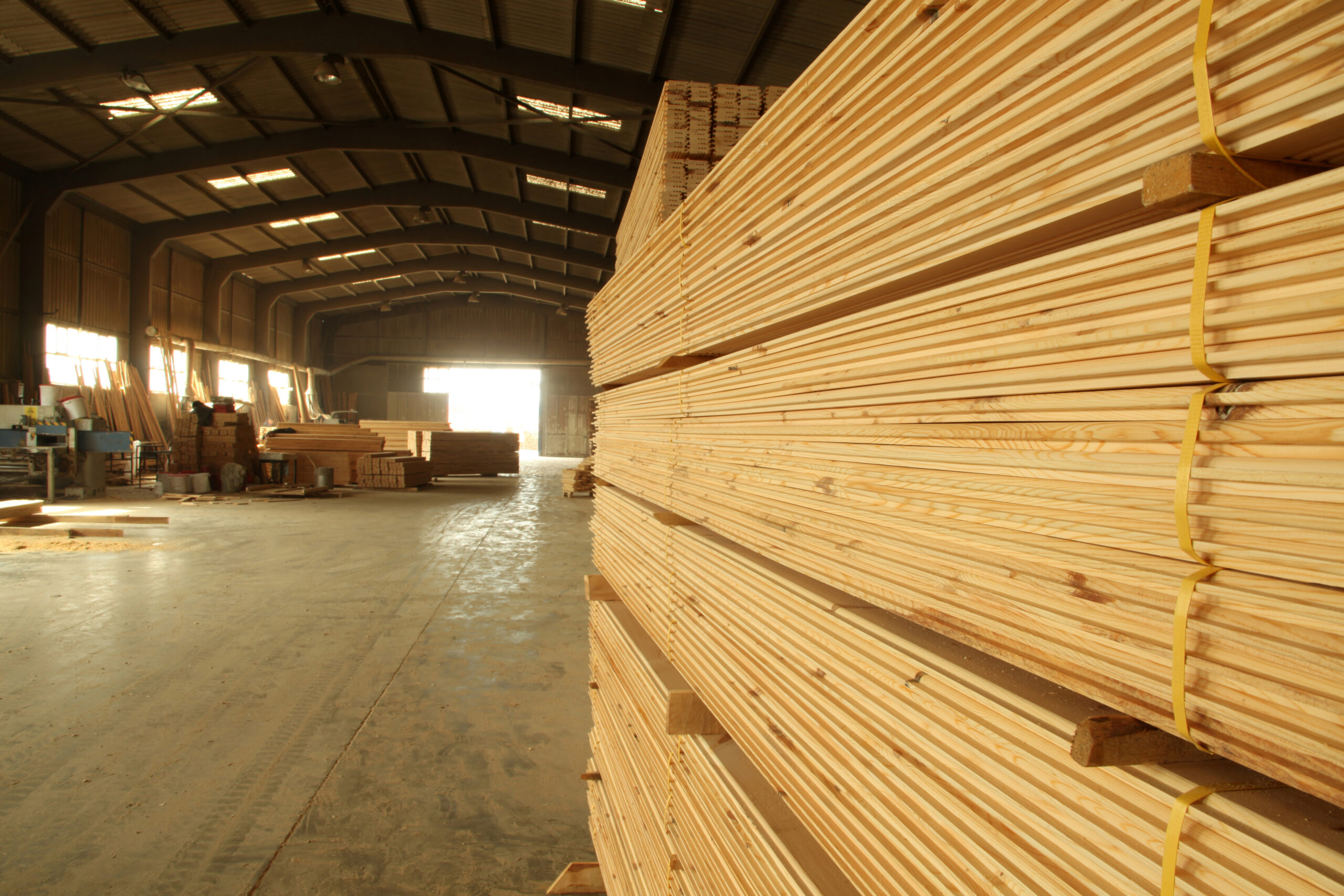 Wood timber construction material. Pile of construction timber at the construction site